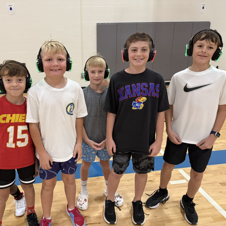 Group of 4th graders with silent disco headphones