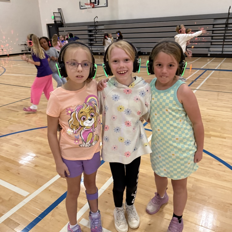 Group of 4th graders with silent disco headphones