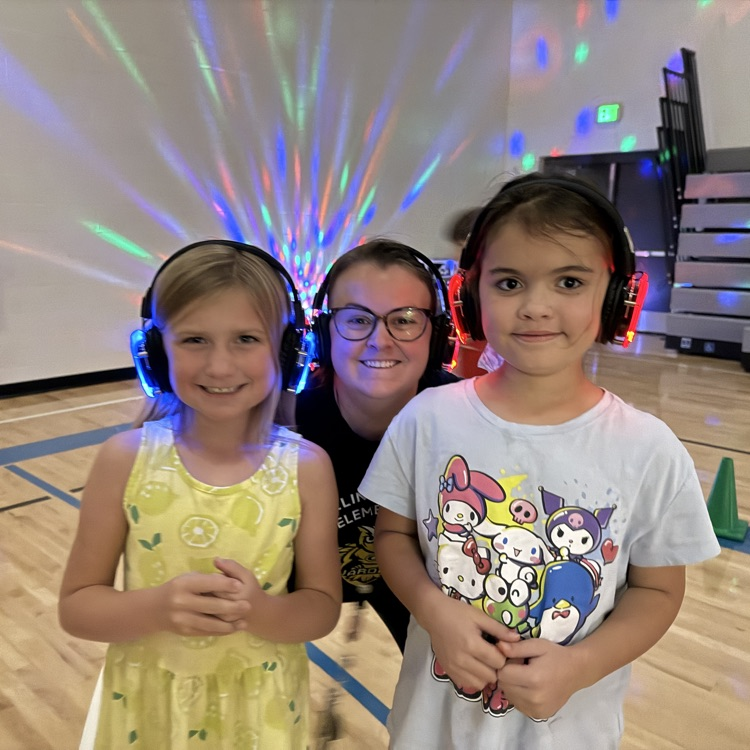Group of 3rd graders with silent disco headphones