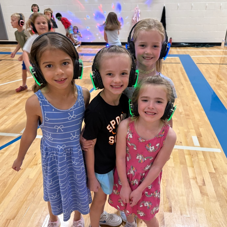 Group of kindergarteners with silent disco headphones