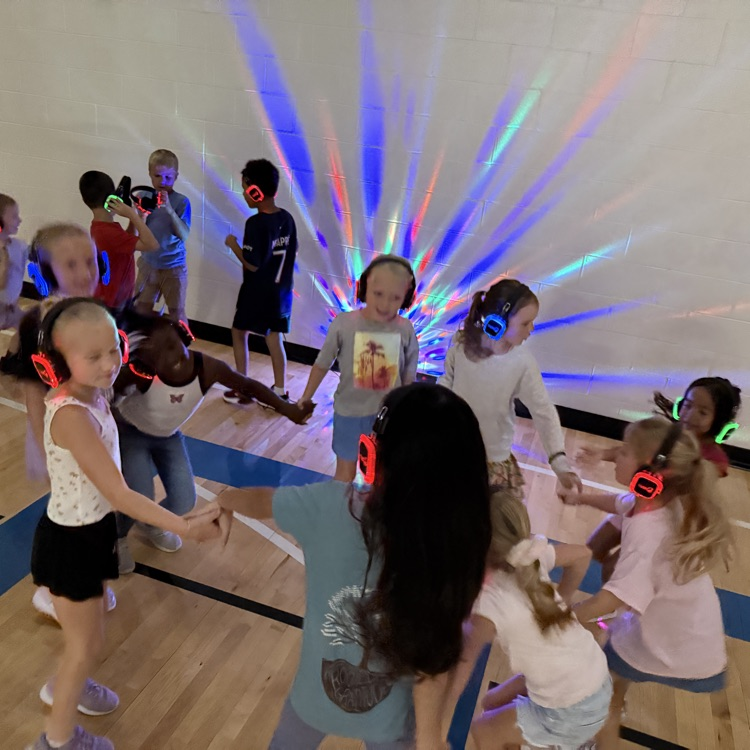 Group of 1st graders dancing at silent disco