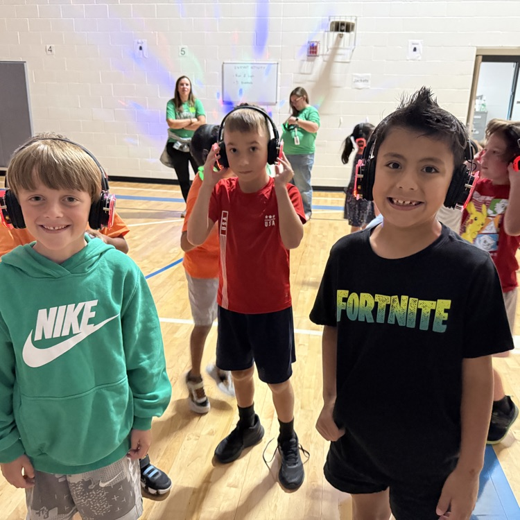 Group of kindergarteners with silent disco headphones
