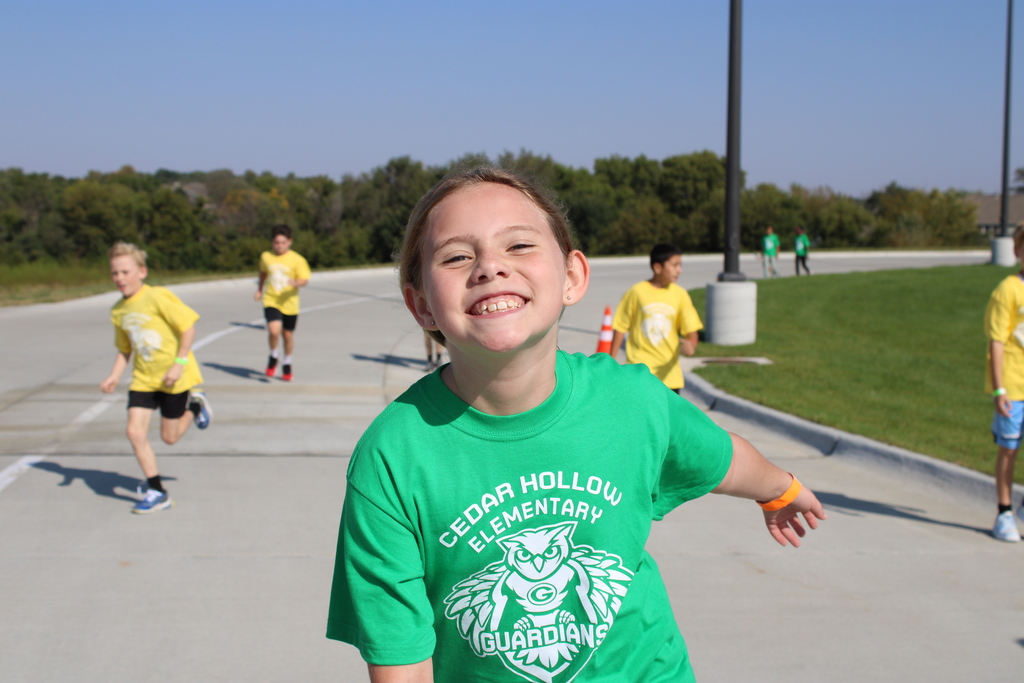 A fourth grade student shows how much fun the Hollow Hustle is with her big smile! 