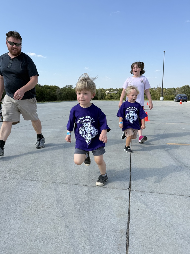 Students run with others during their race.
