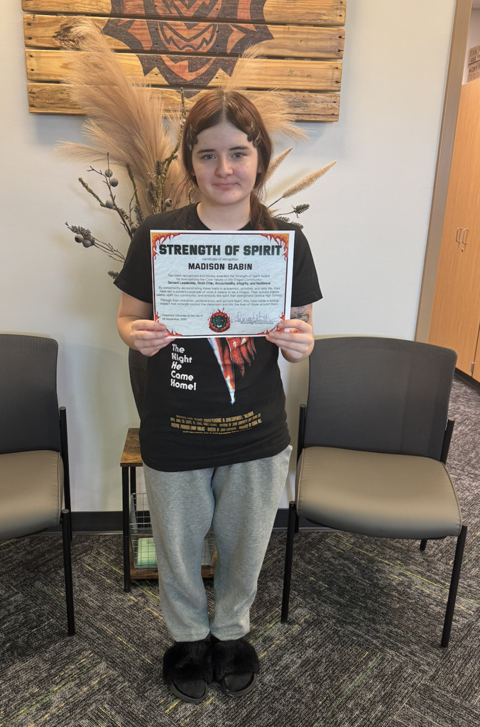 Madison Babin holding her certificate