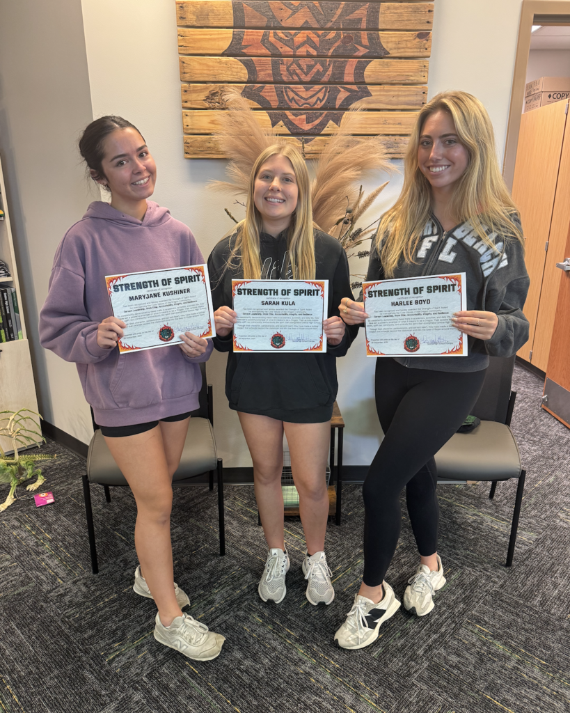 MJ Kushiner, Sarah Kula, and Harlee Boyd holding their certificates