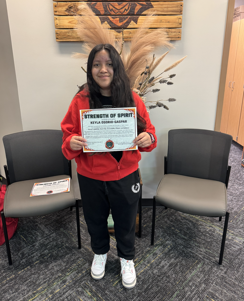 Keyla Osorio-Gaspar holding her certificate