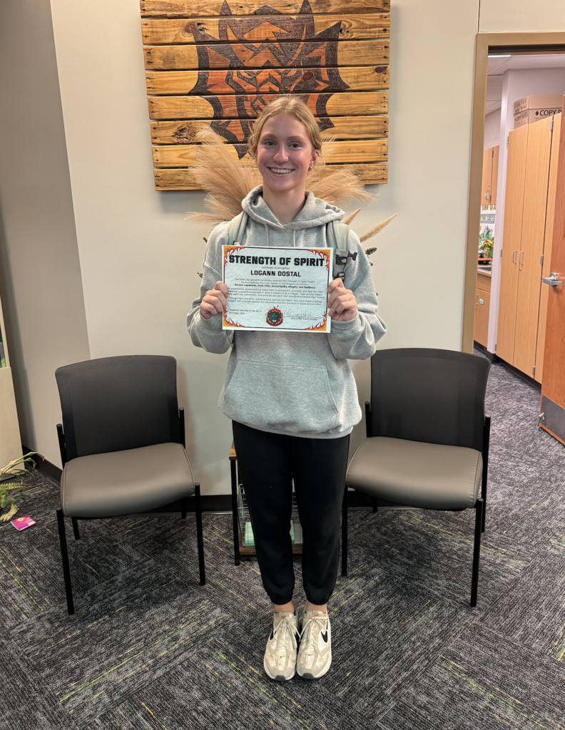 Logann Dostal holding certificate