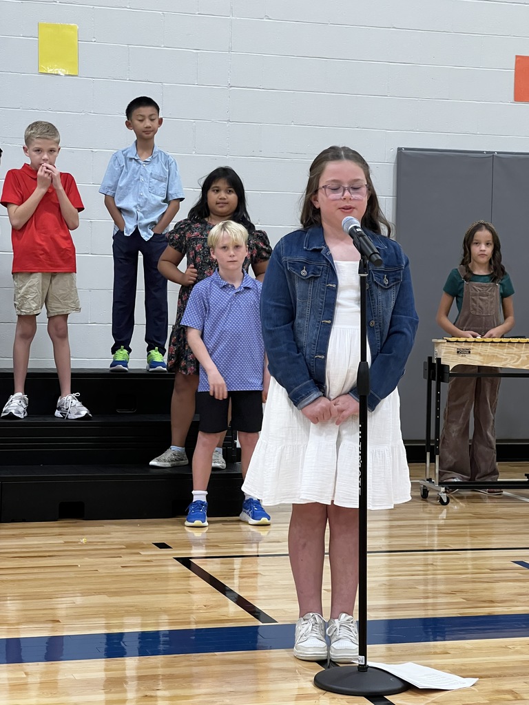 A 3rd grade student singers her solo during the performance.