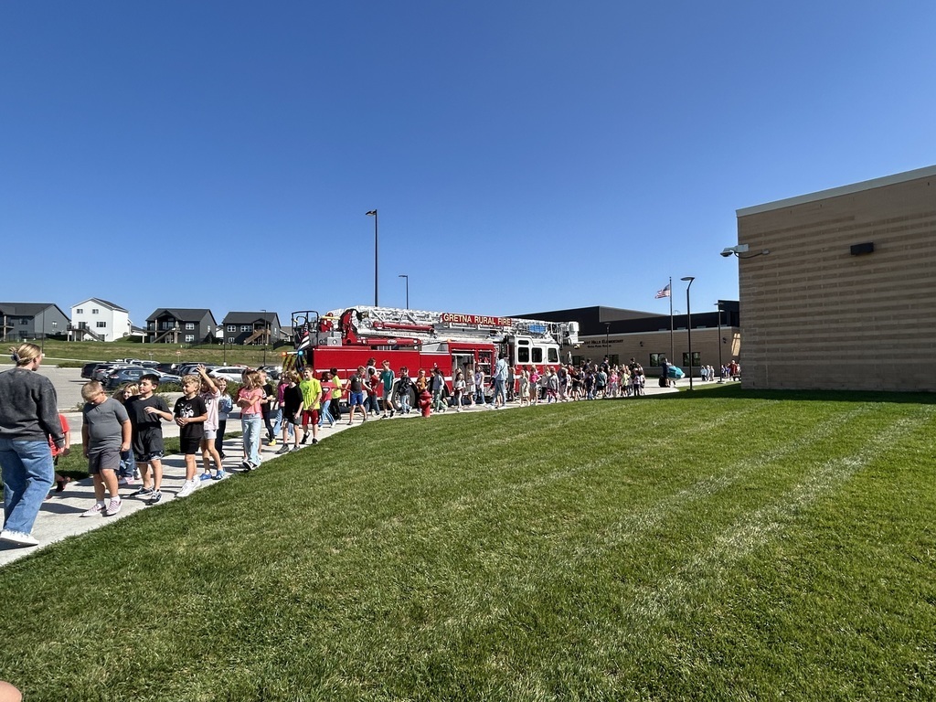 students walking by the fire truck