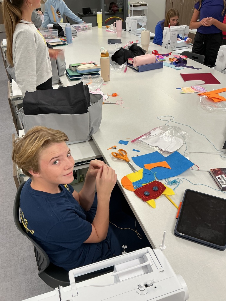 8th grade sewing student working on the monster project. 