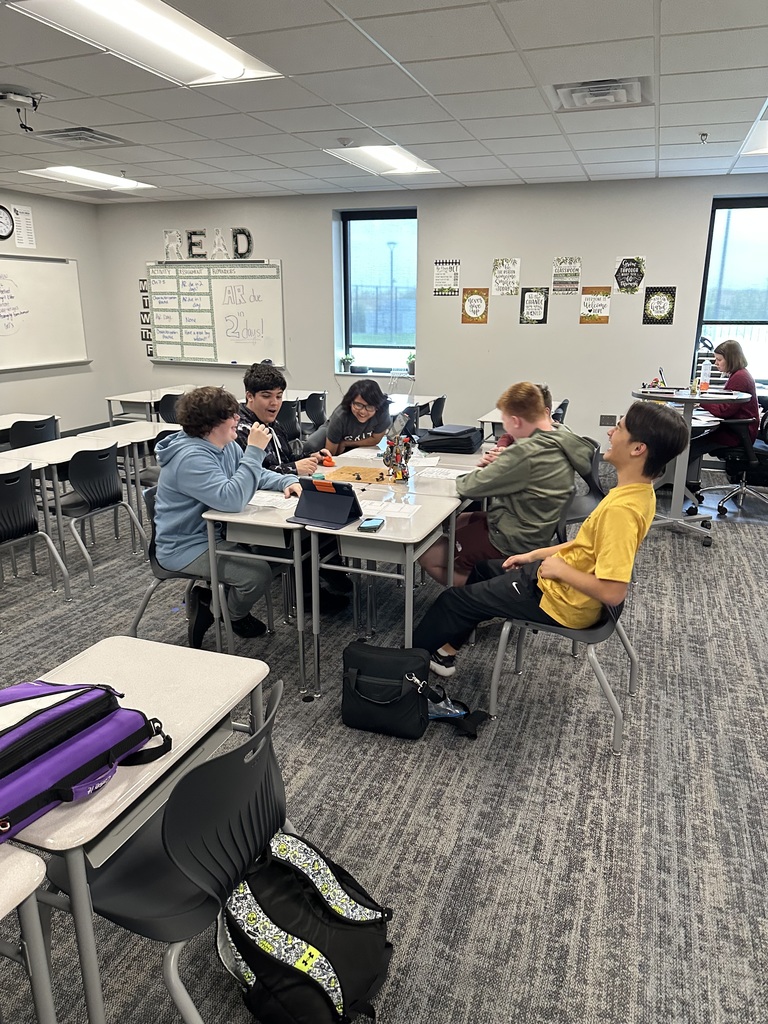 Students playing Dungeons and Dragons in a classroom. 