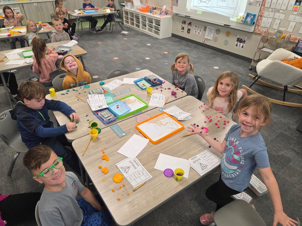 kindergartener working with playdoh and toothpicks