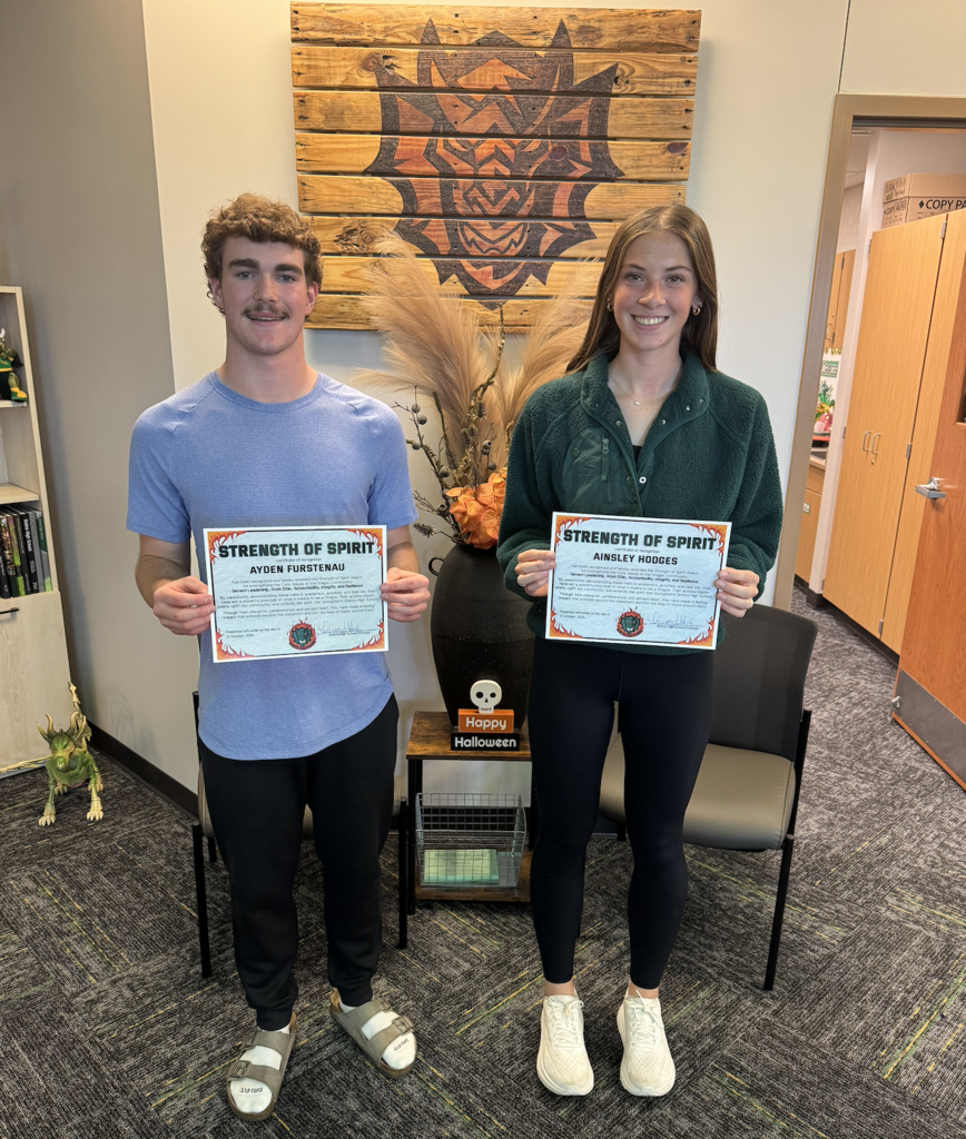 Ayden Furstenau and Ainsly Hodges hold their Strength of Spirit certificates.