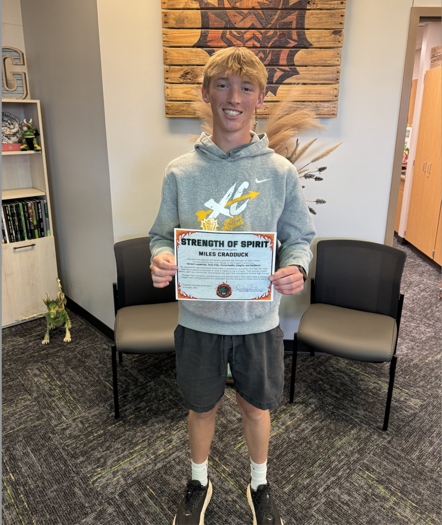 Miles Cradduck holds his Strength of Spirit certificate