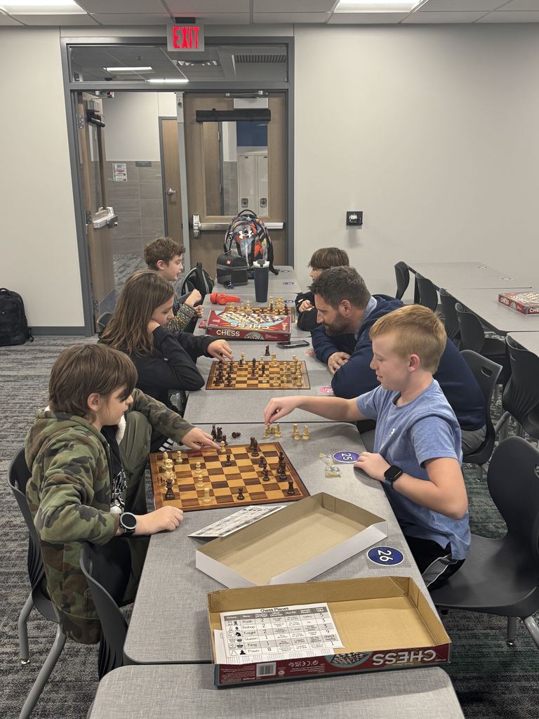 A group of 5 students and one teacher is playing chess on three different chess boards. 