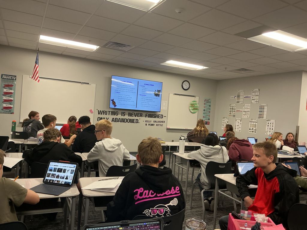 Students in an English classroom are working at their desks. 