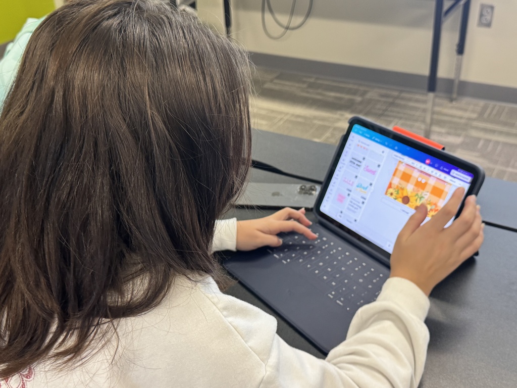 Photo of a student working on an iPad.