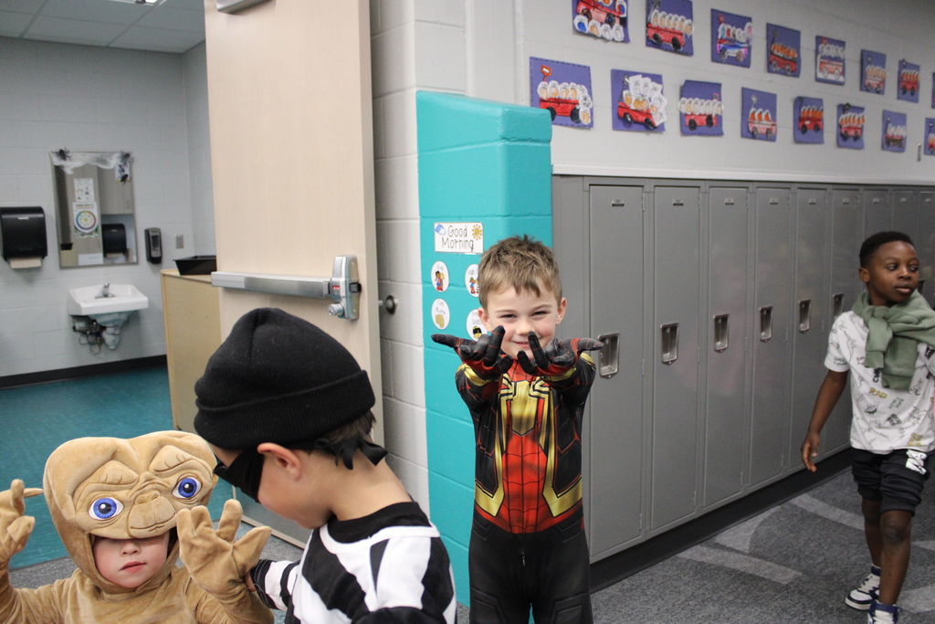 Spiderman shoots his web as he walks by! 