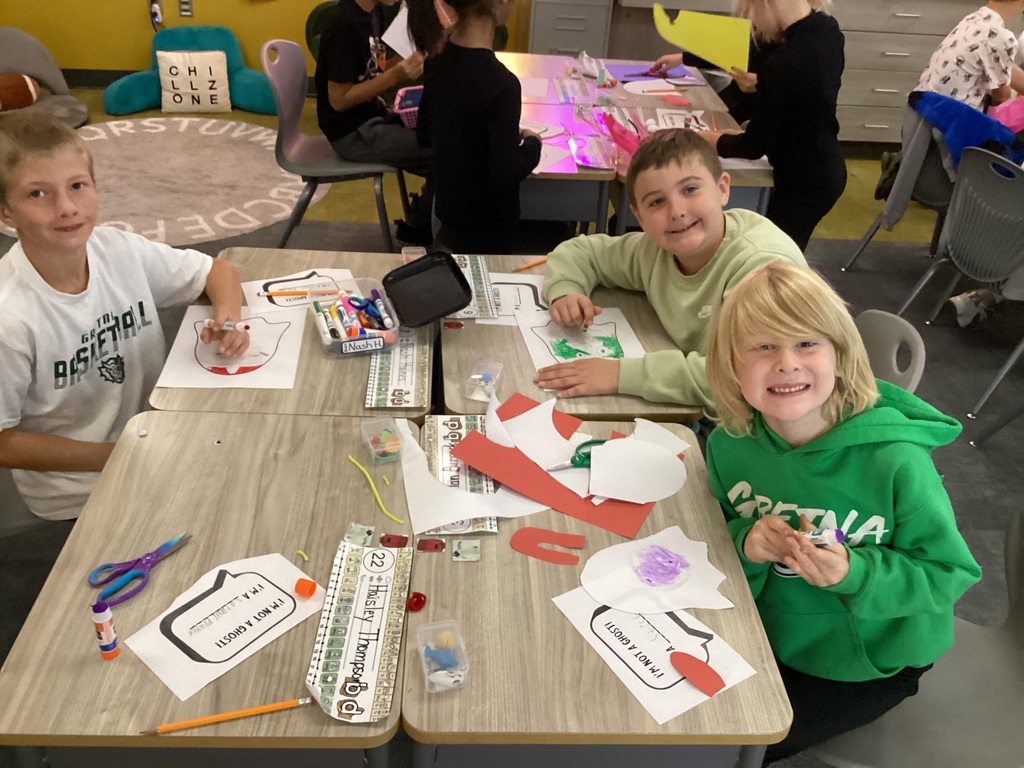 students doing halloween crafts