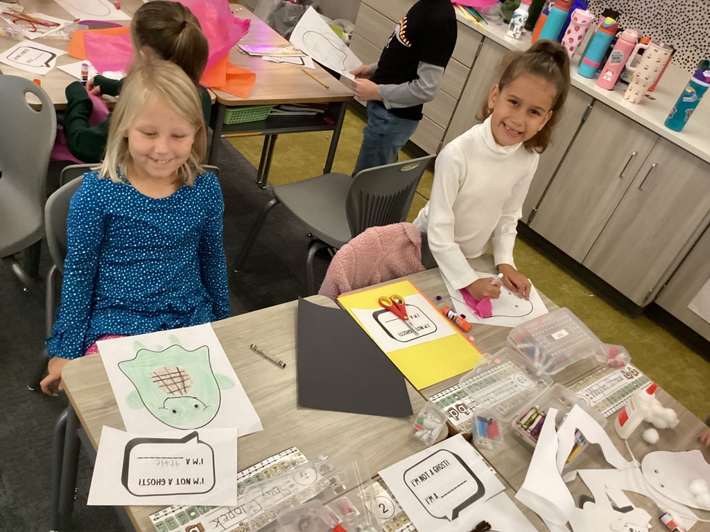 students doing halloween crafts