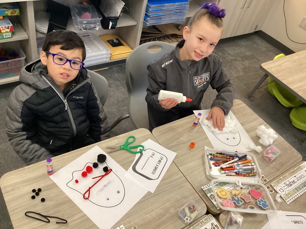 students doing halloween crafts