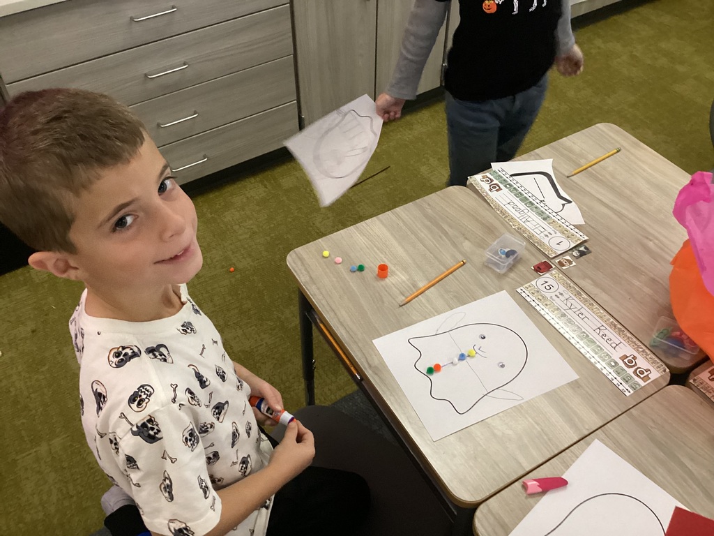 students doing halloween crafts