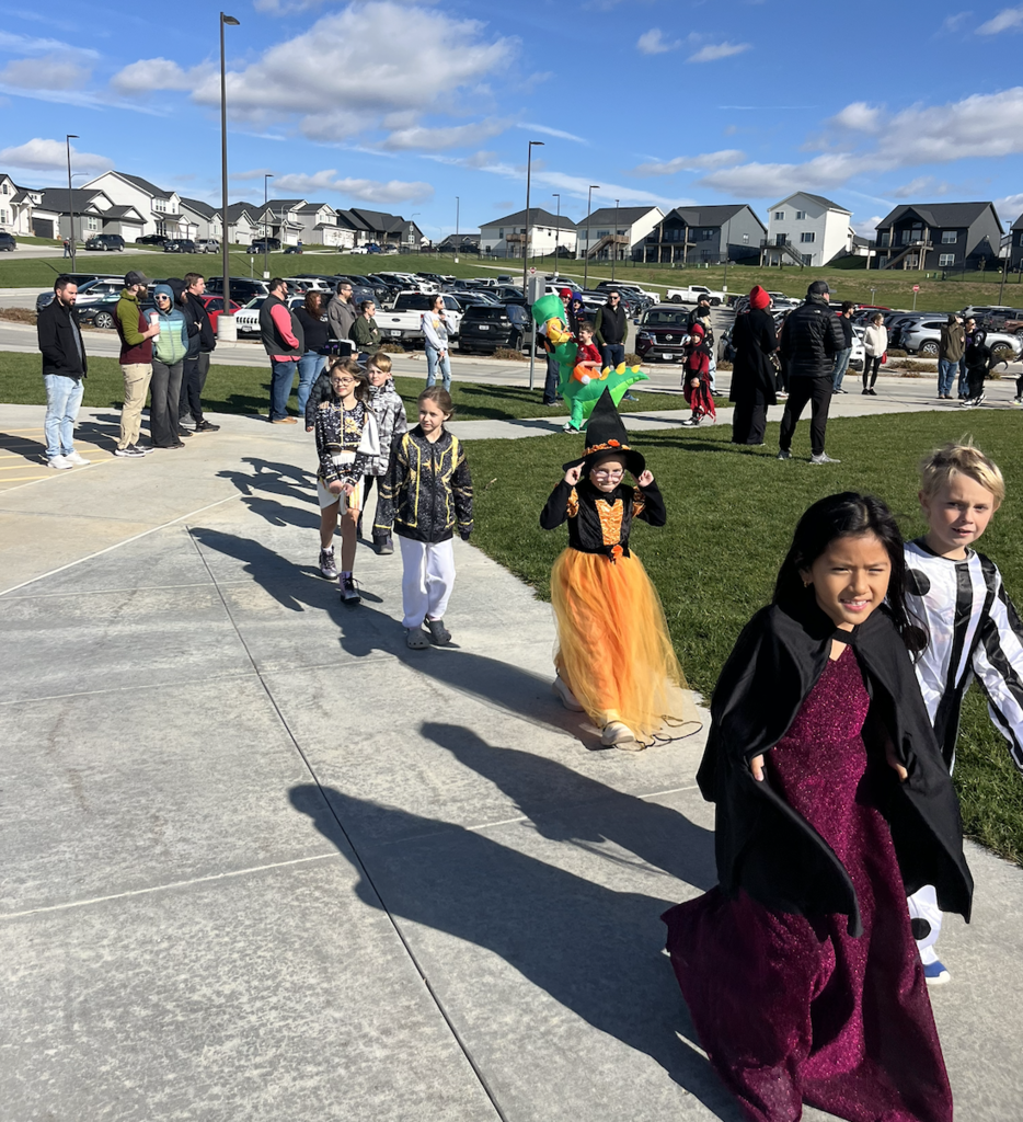 students in a parade for halloween