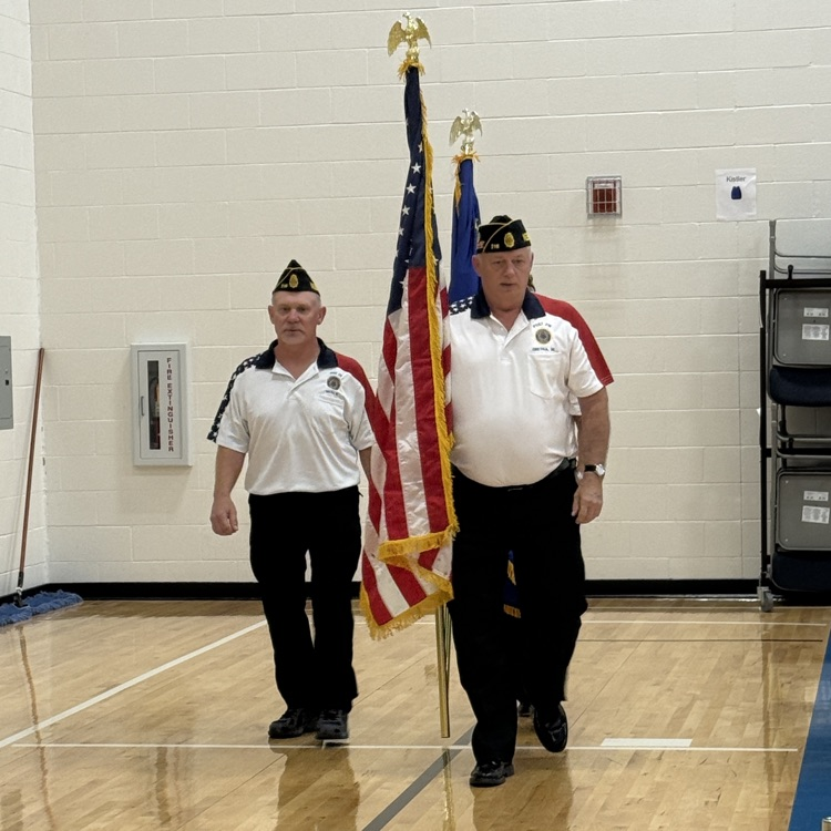 3 veterans marching into the gym to present the colors
