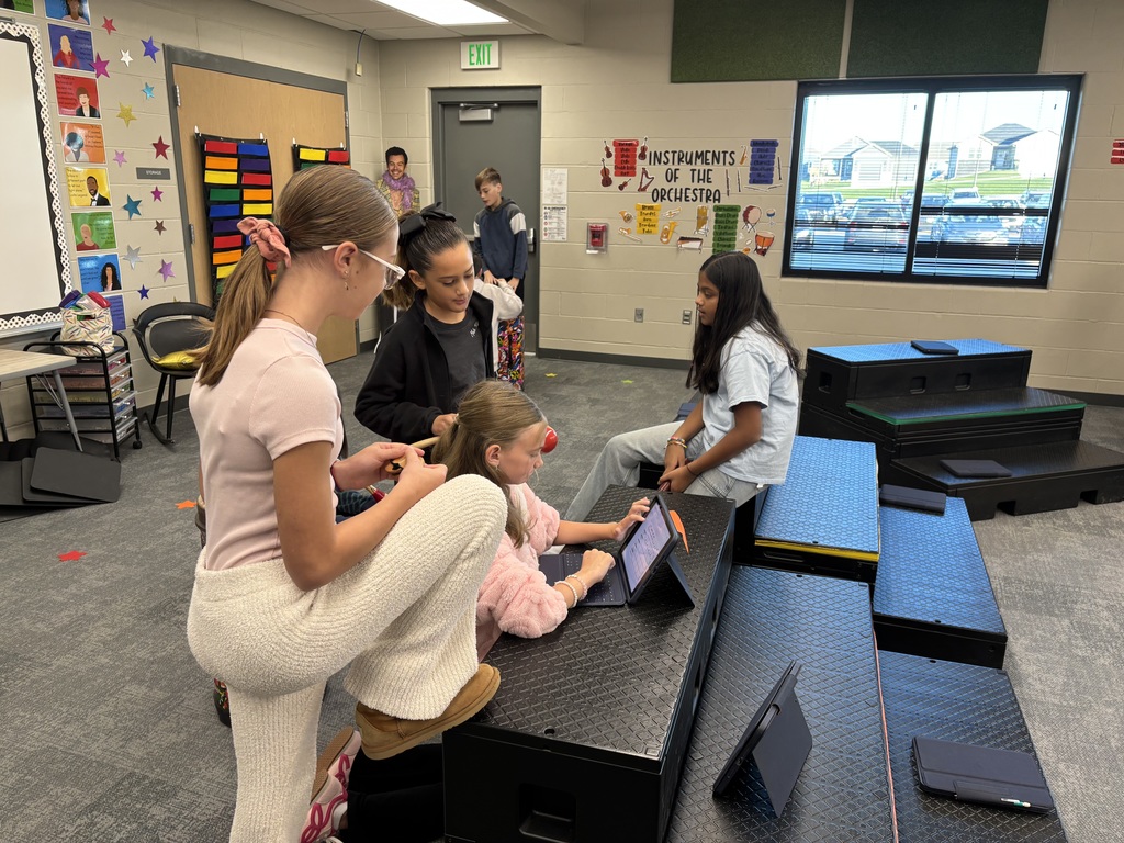 fifth graders create ensembles for drums in music class using iPads