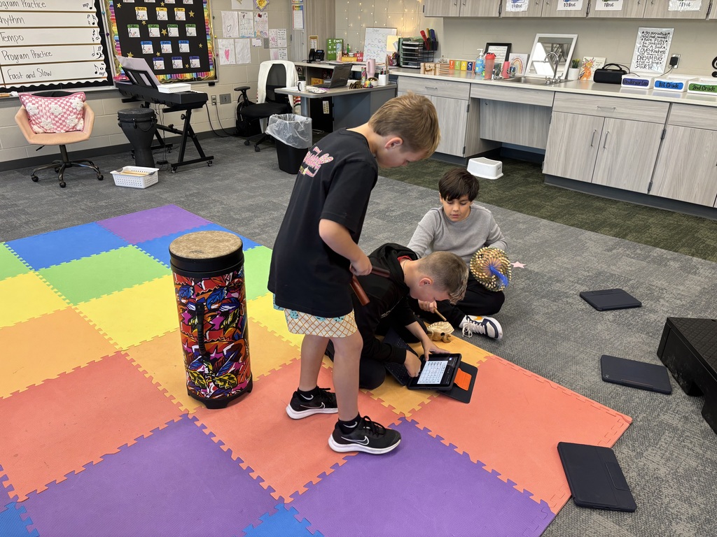 fifth graders create ensembles for drums in music class using iPads