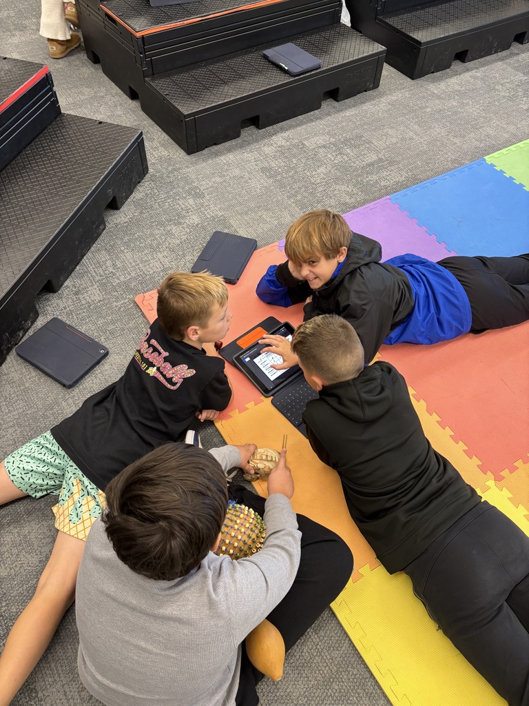 fifth graders create ensembles for drums in music class using iPads