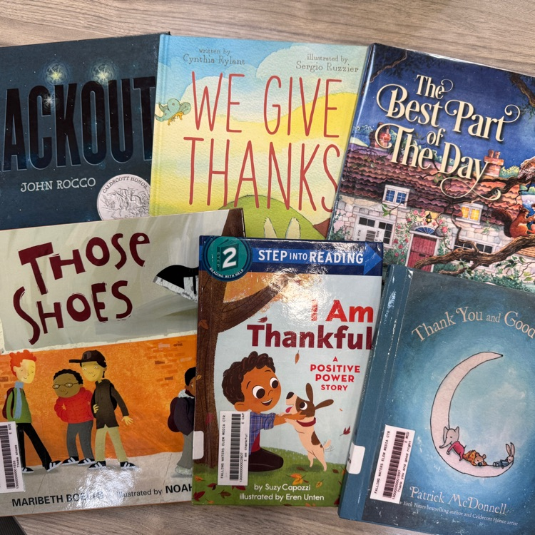The books Blackout, We Give Thanks, The Best Part of the Dat, Those Shoes, I am Thankful and Thankful and Goodnight are displayed  