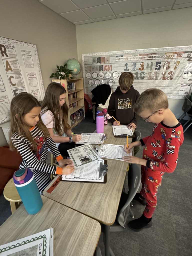 students working together on a project in the classroom