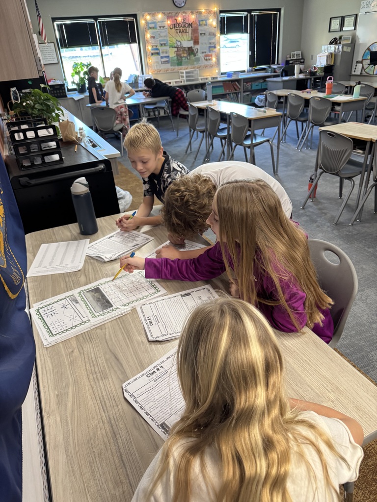 students working together on a project in the classroom