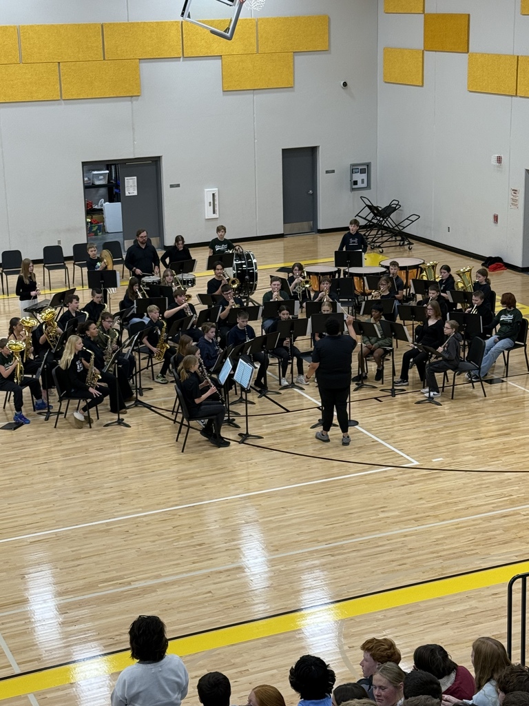 Photo of the GCMS band playing a song in the gym at the assembly.