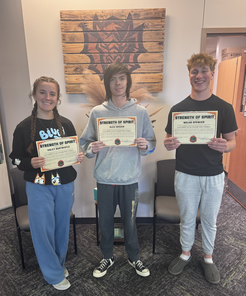 Haley Burtwistle, Alex Seeger and Nolan Spencer hold their Strength of Spirit certificates
