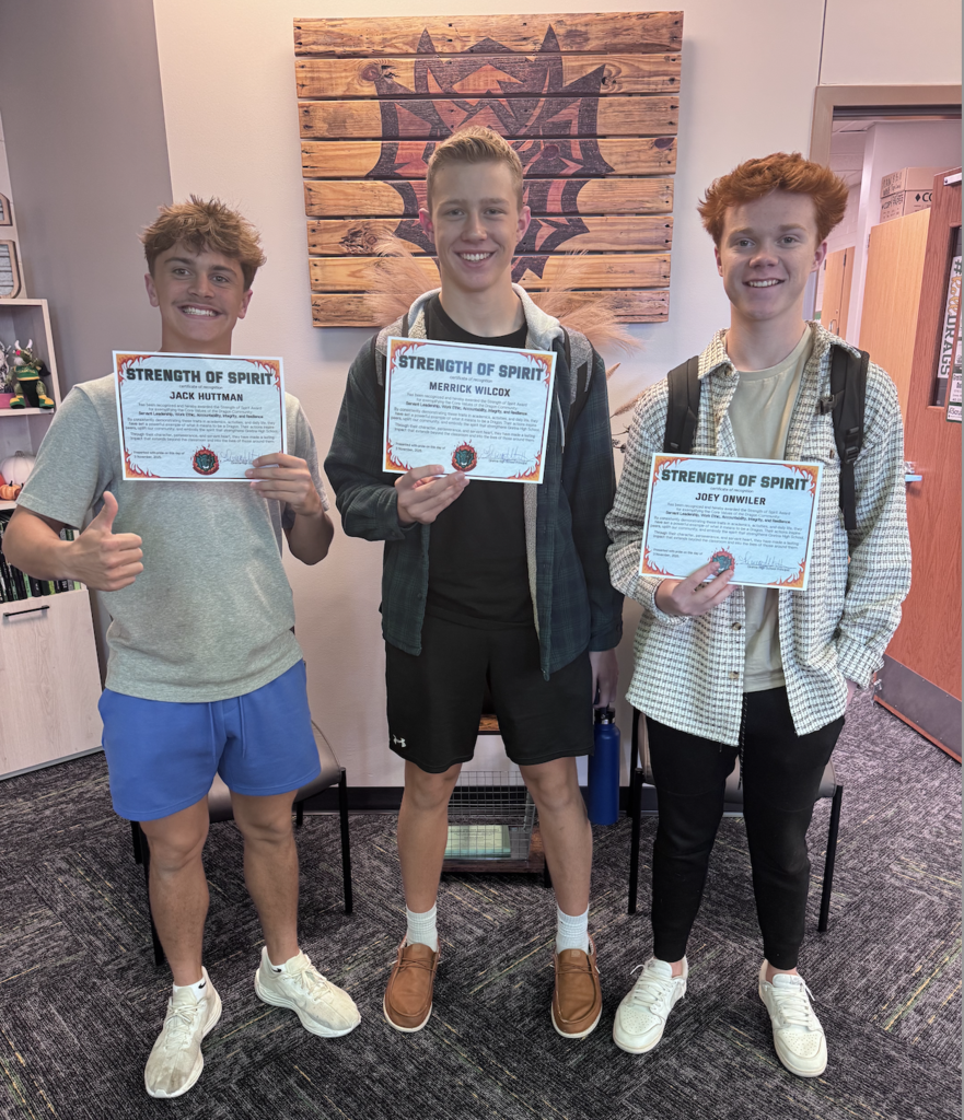 Jack Huttmann, Merrick Wilcox and Joey Onwiler hold their Strength of Spirit Certificates