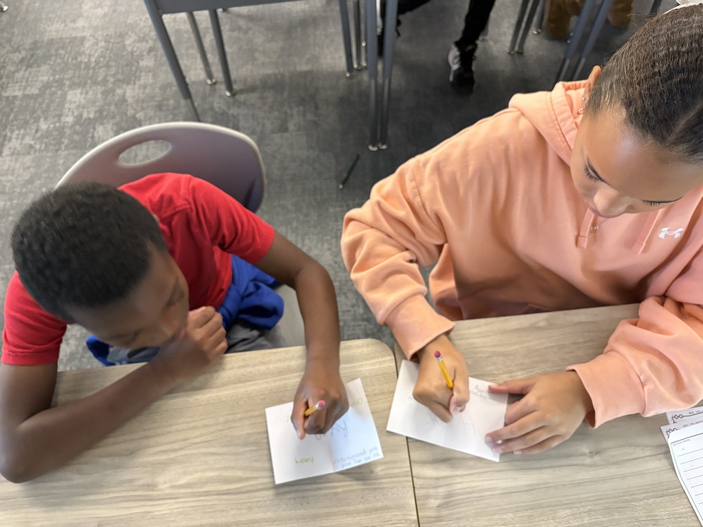 Students writing letters