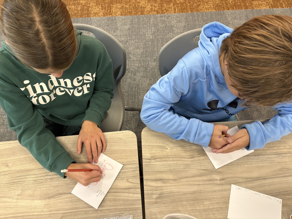 Students writing letters