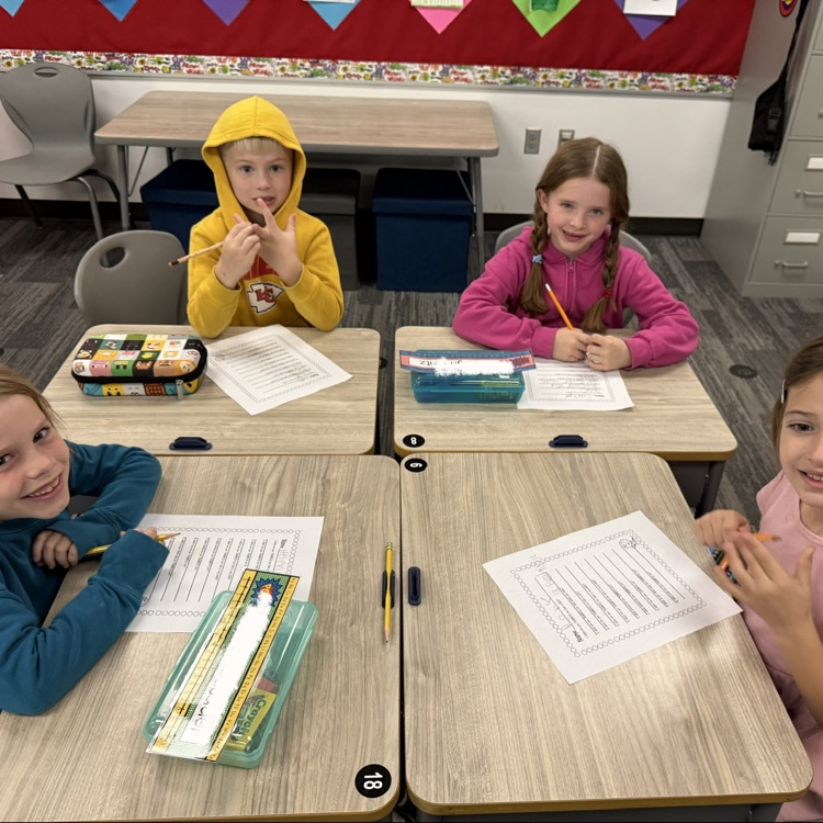 4 students work on gratitude lists