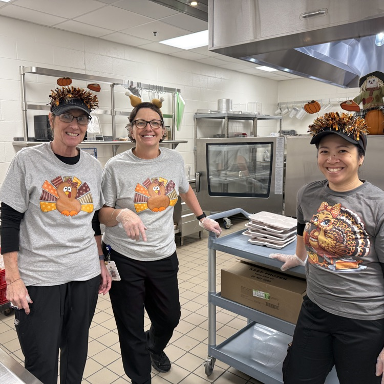 our kitchen staff smiles with their turkey leg hats