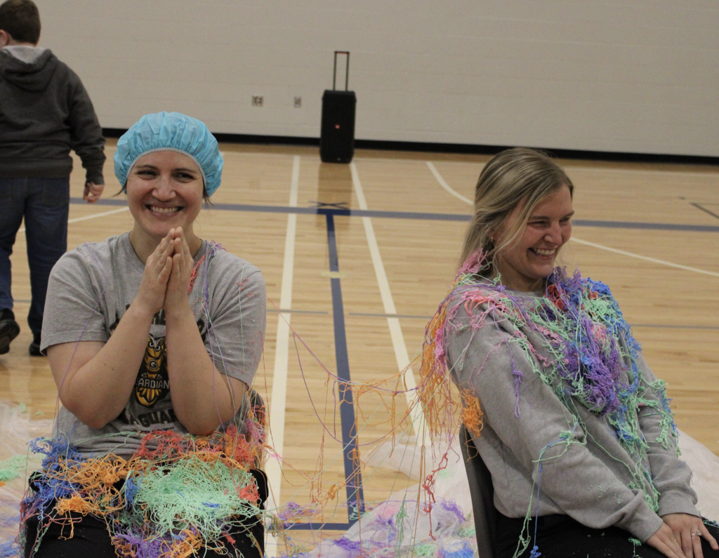 Mrs. Holston and Mrs. Rudd smile after getting sprayed!