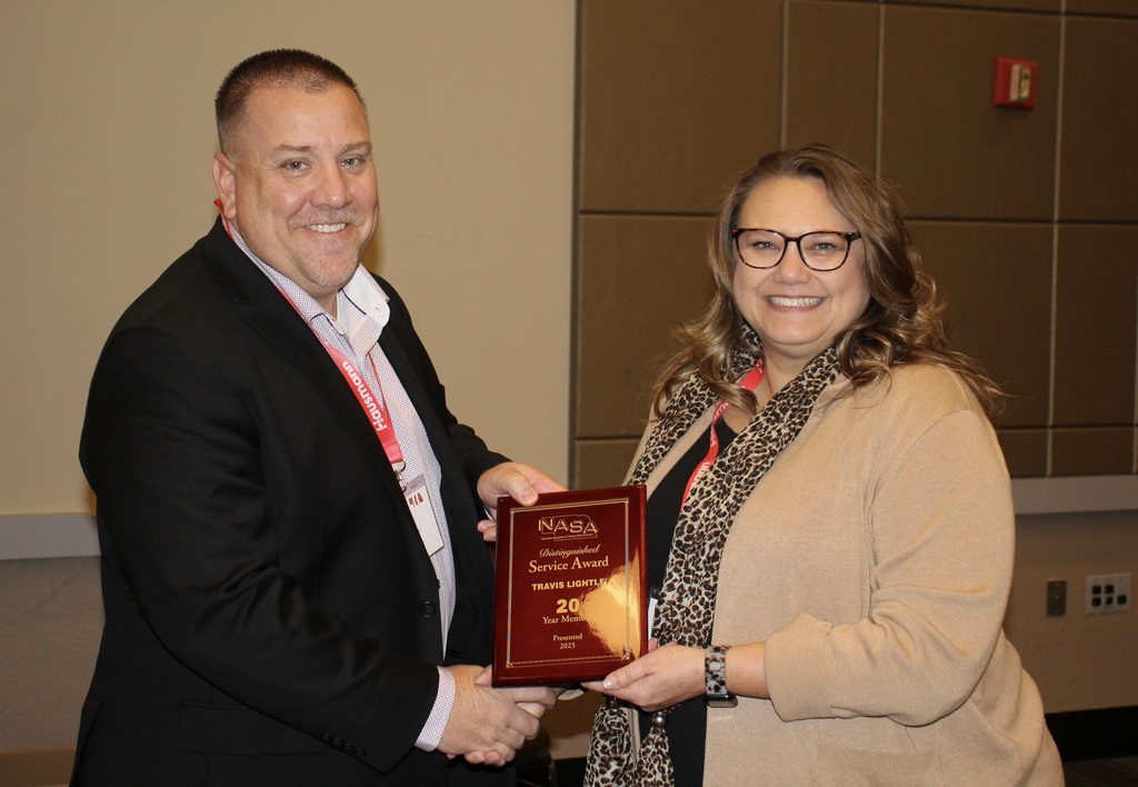 Superintendent Travis Lightle receiving the NASA Distinguished Service Award for 20 years of service.