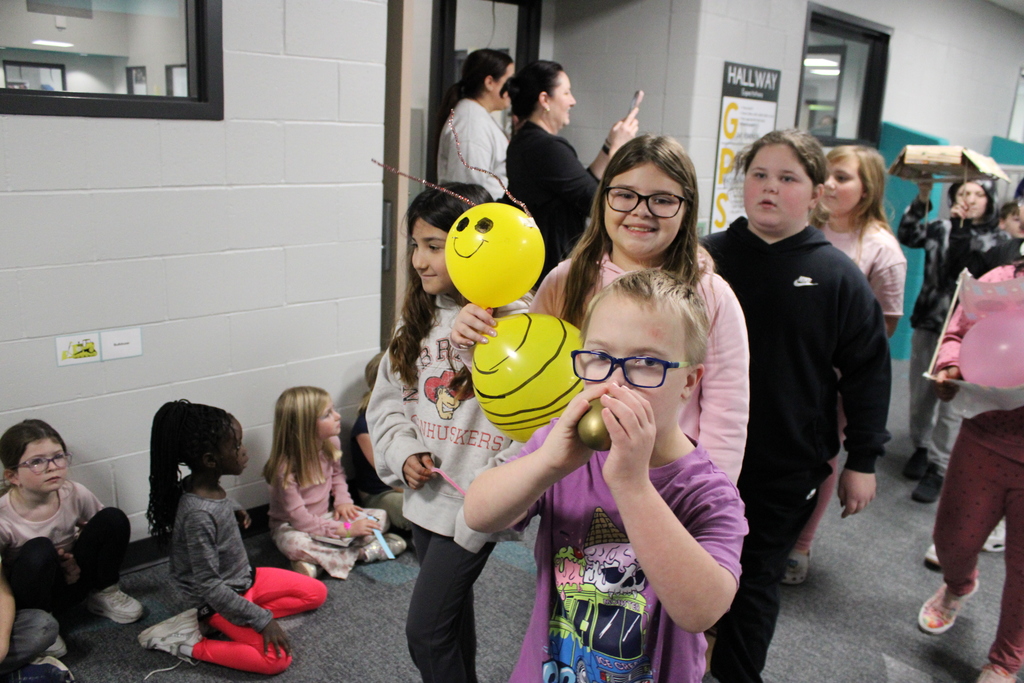 5th graders walk together in the Thanksgiving Day Parade. 