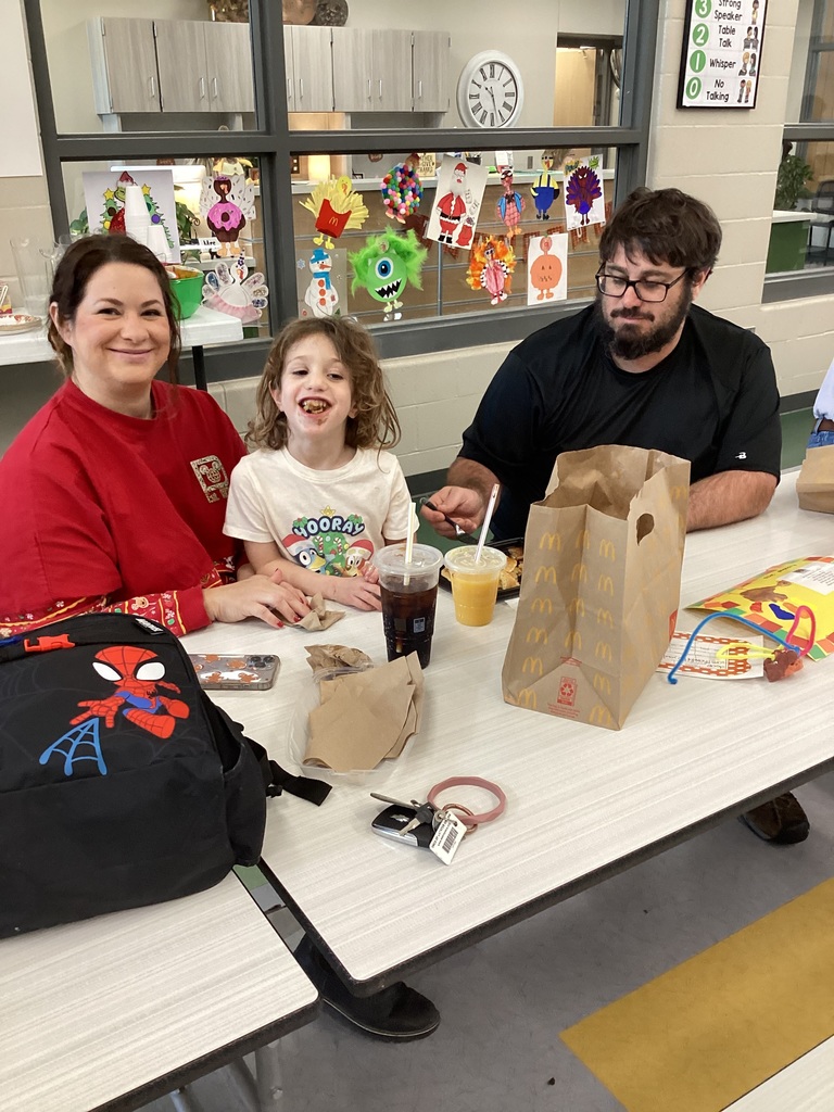student and their family in the cafeteria