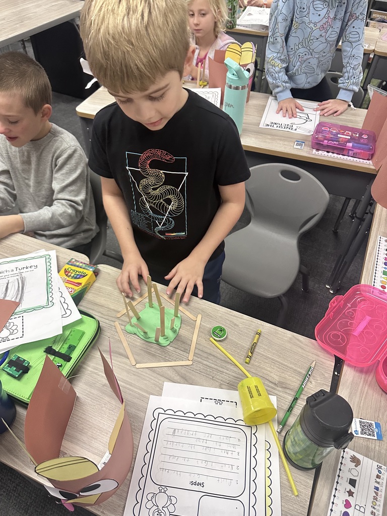 student working on a crafts in class