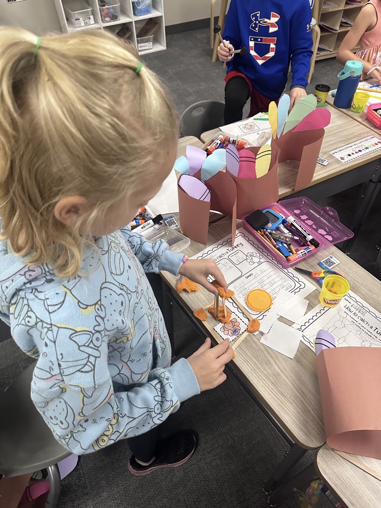 student working on a craft in class 
