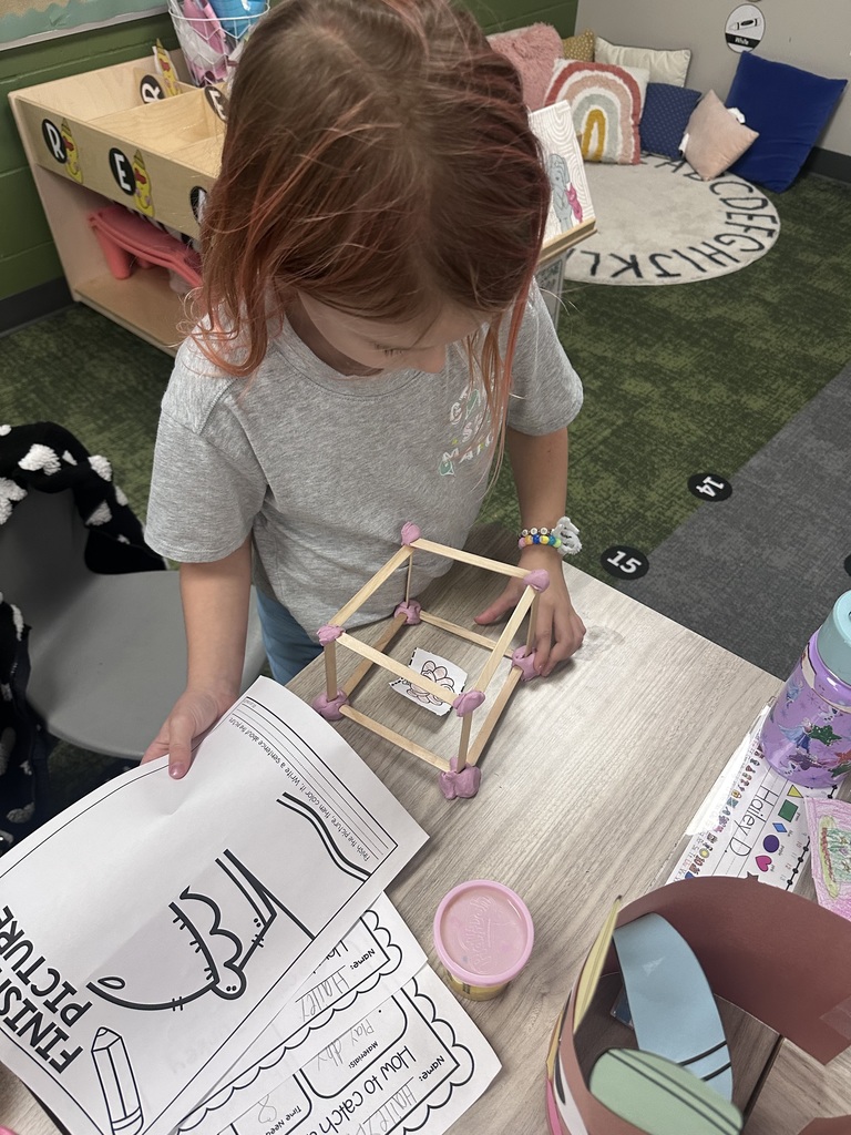 student working on their turkey trap craft in class