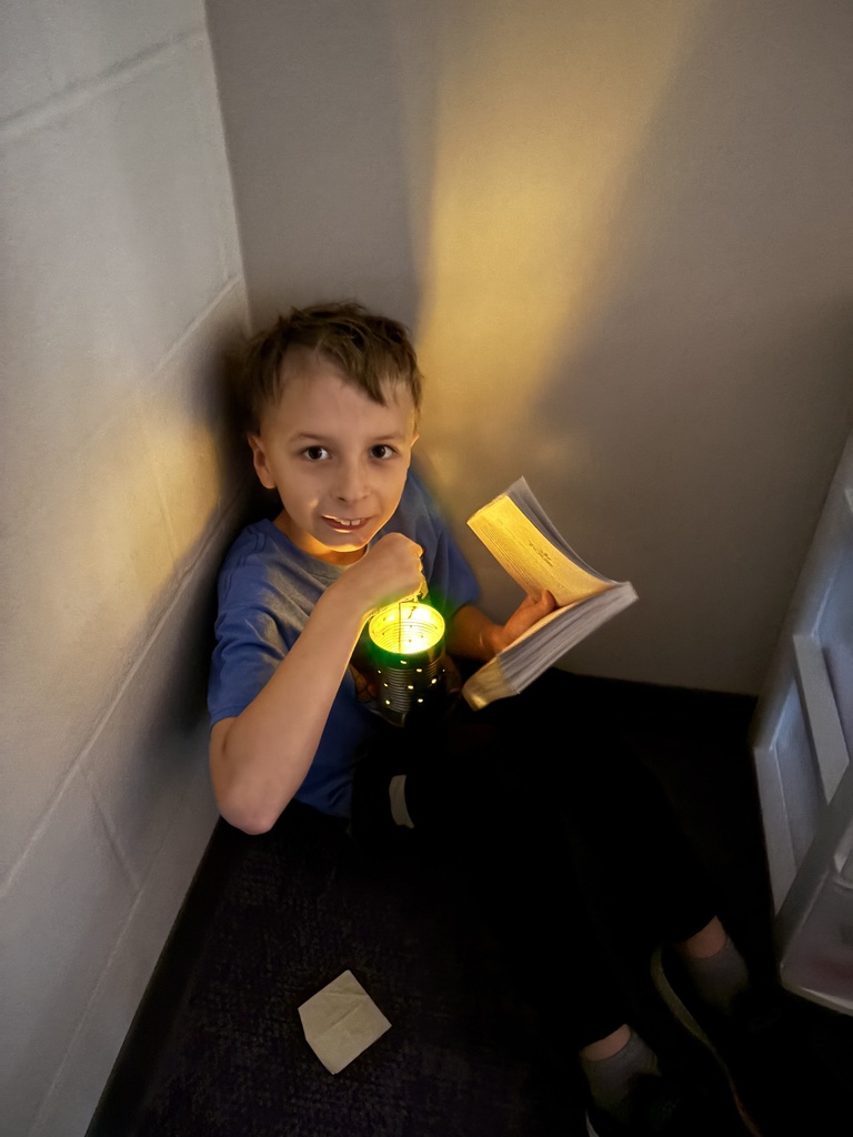 Student with homemade flashlight